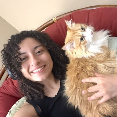 Dani in a chair with a cat