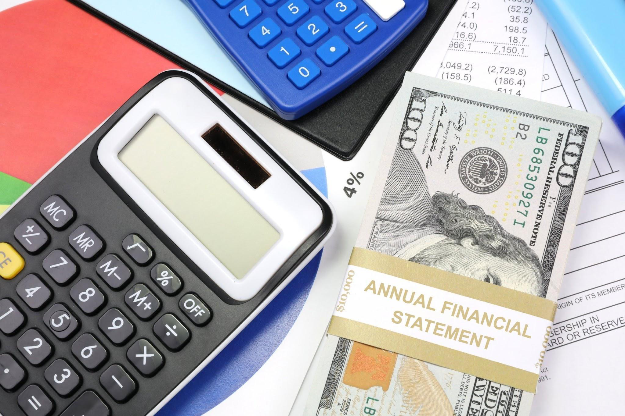 Slide showing a calculator and money with the heading Calculating the Costs: Total Direct Costs and Total Indirect Costs.