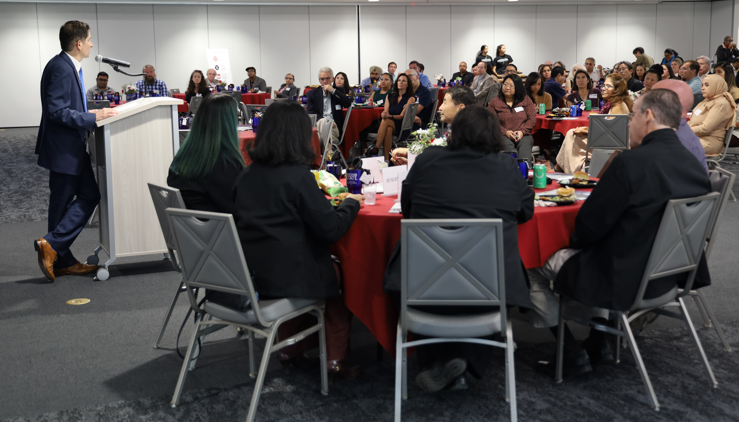 president speaking in front of a crowd