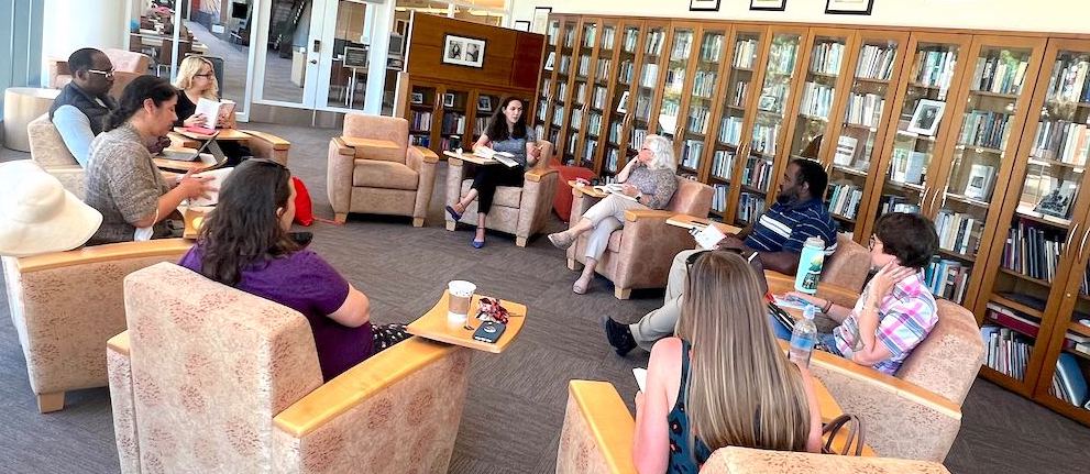 A group of 10 faculty and staff gathered in the Levine Reading Room to discuss their reading