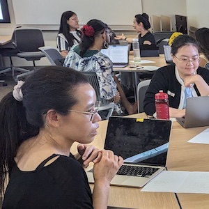 Faculty conversing during workshop