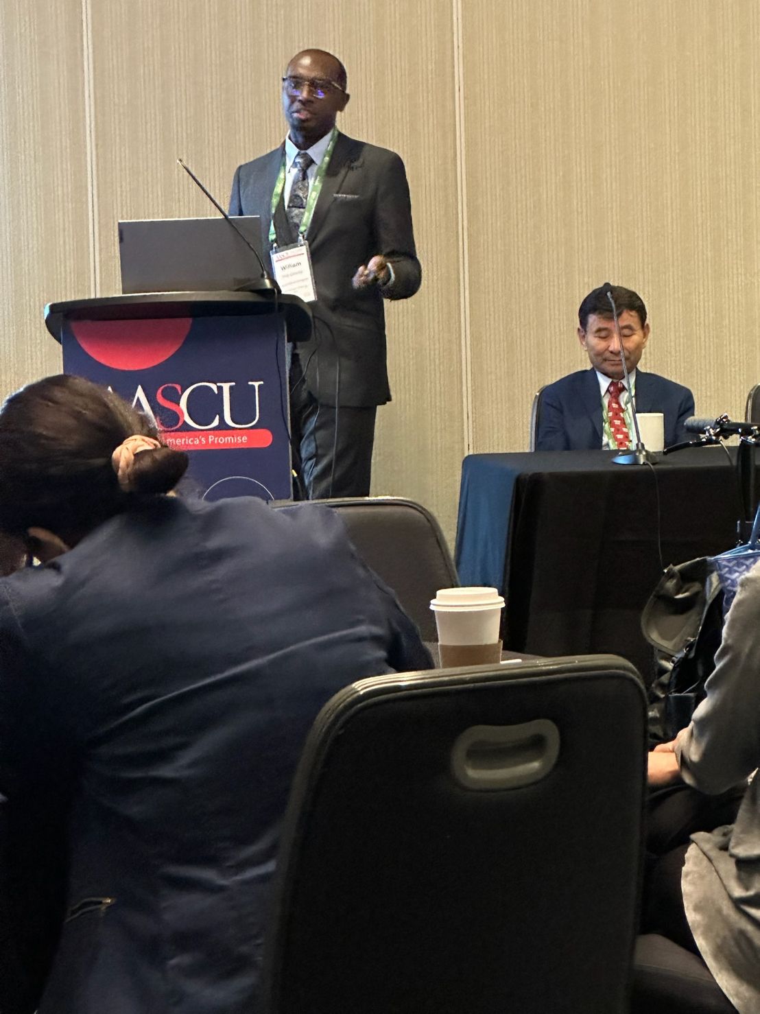 William Hardaway at a podium giving a presentation at a conference